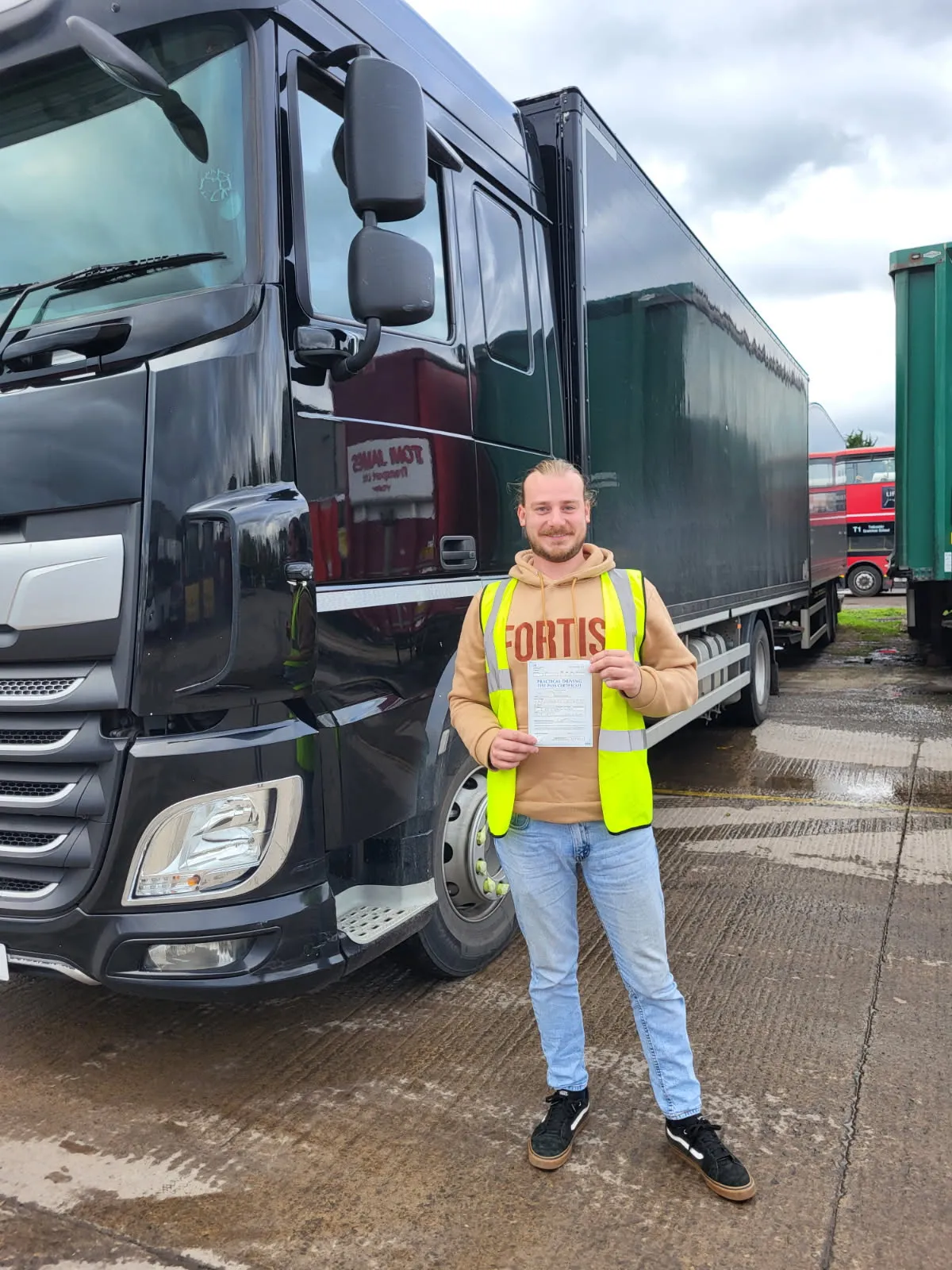 high vis man holding paper